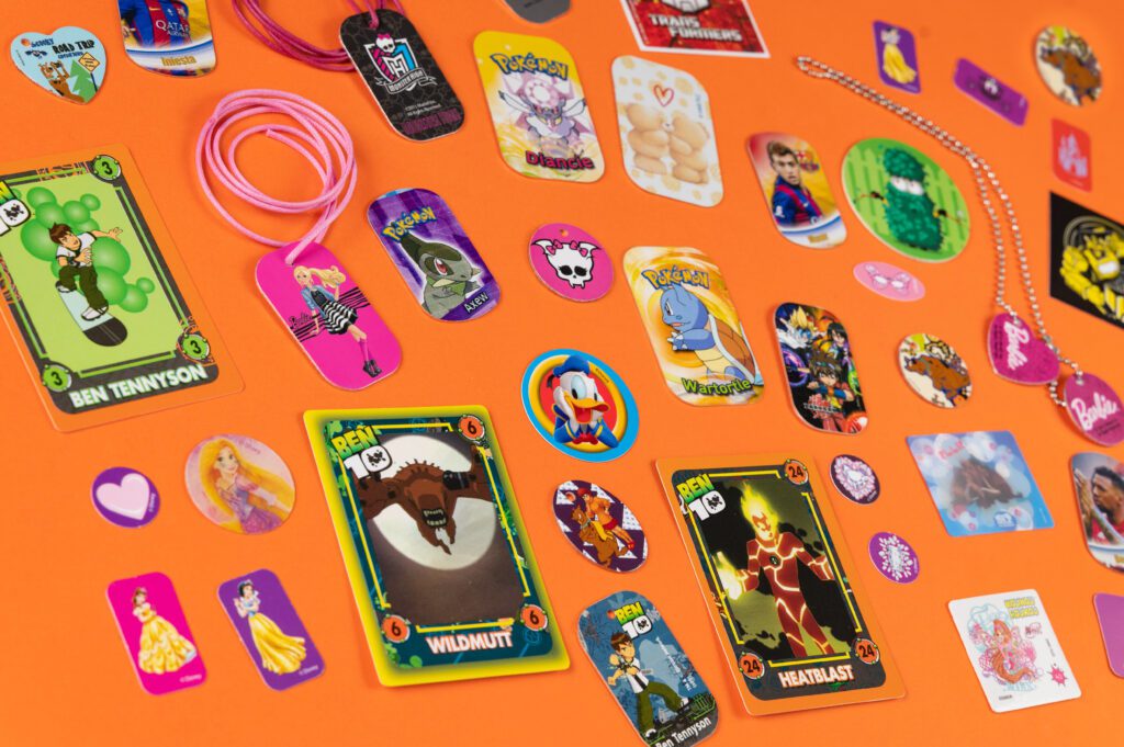 metallic tazos, promo sitckers & cards in snacks